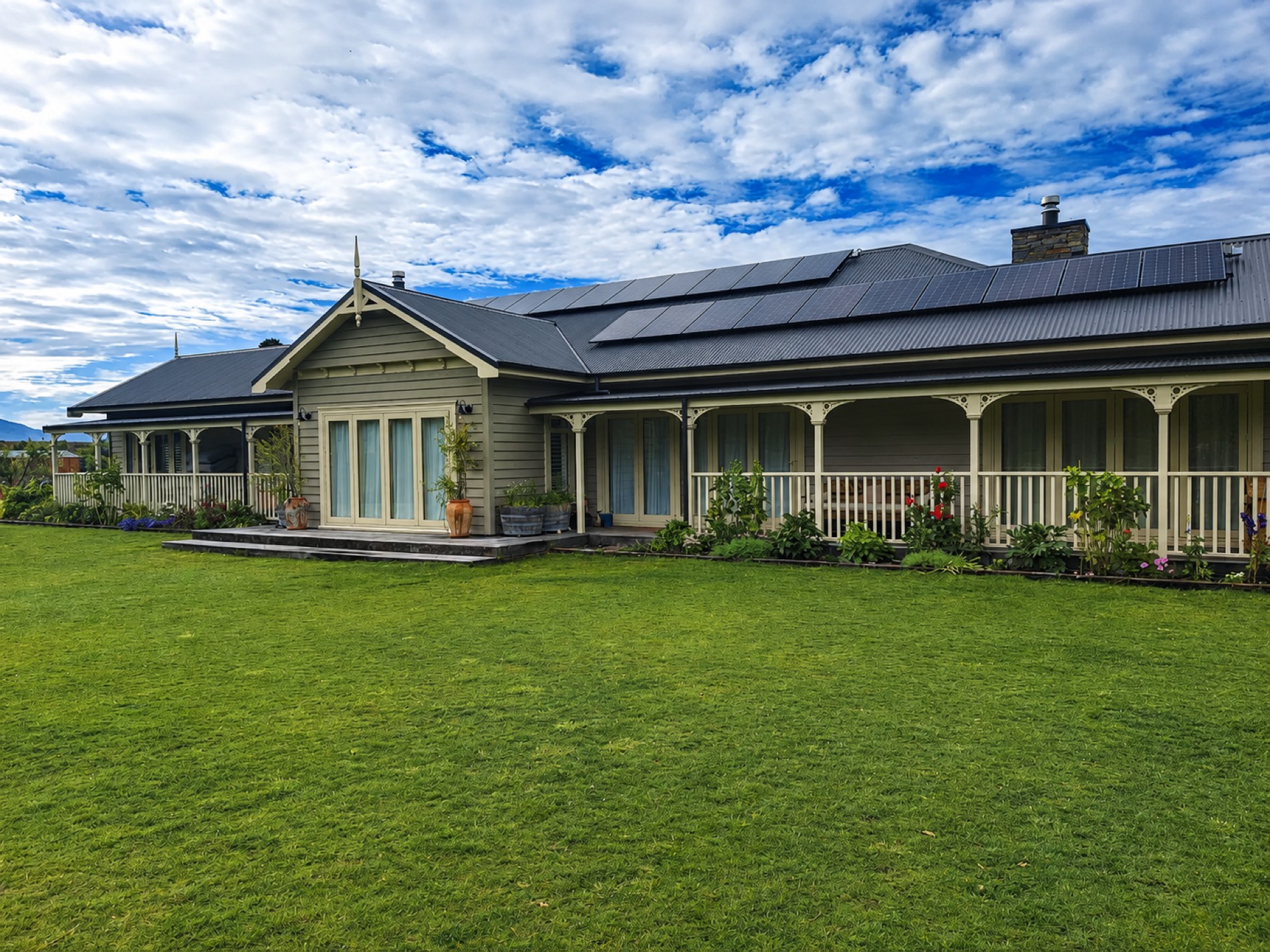 Freshly repainted villa with a full length veranda and solar panels
