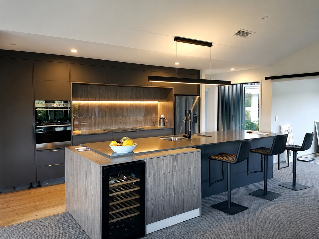 Finished living space around a charcoal kitchen with timber features
